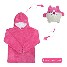 Pink kids hoodie blanket with cat ears and a plush pet toy, a warm fleece pullover for winter play and bedtime cuddles.