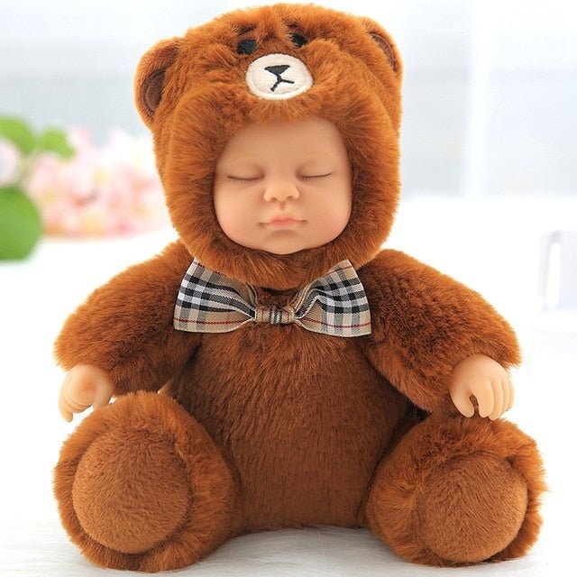 Baby in a brown teddy bear costume with a checkered bow tie.