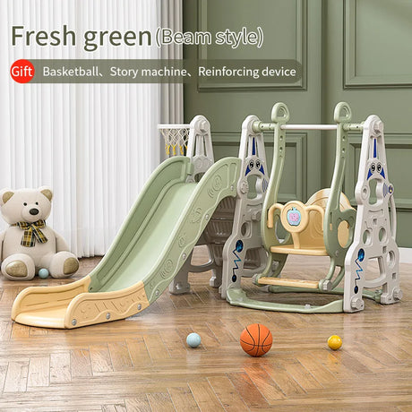 Children's play set with slide and swing on a wooden floor, featuring a teddy bear and sports balls.