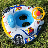 Children's inflatable car seat with steering wheel on grass