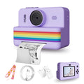 Purple instant print camera with a rainbow stripe, a printed photo, a lanyard, a USB cable and paper rolls