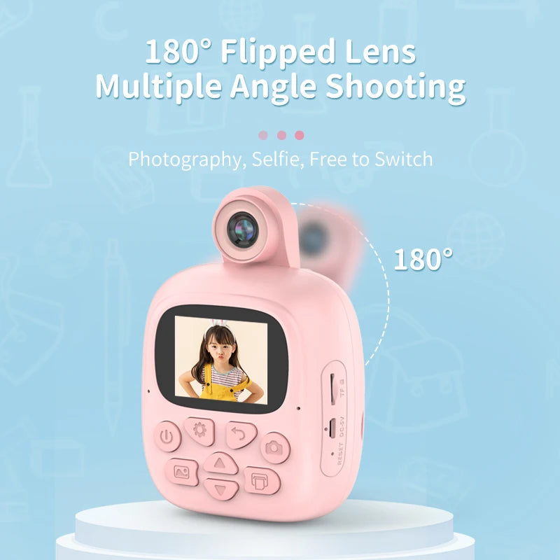 Pink kids instant print camera with the lens flipped 180 degrees for different shooting angles