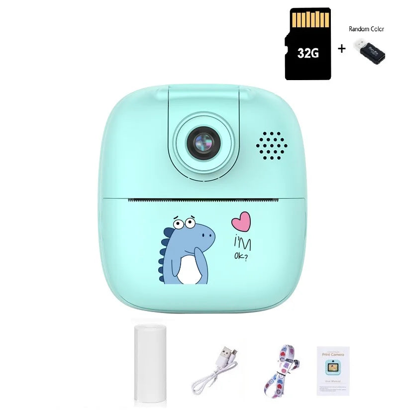 Teal dinosaur kids camera with a 32G memory card, one paper roll, USB cable, lanyard and manual