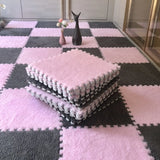 Pink and gray checkered foam mats on a floor with decorative vases.