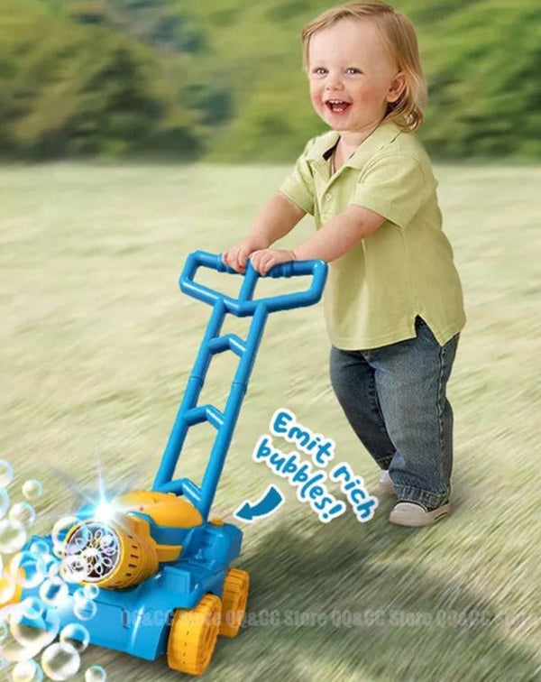 Lawn mower bubble machine push toy used by a child on grass for garden play and summer fun.