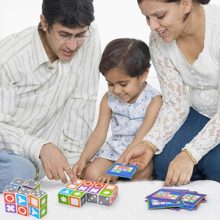 Parents and a young girl playing with matching blocks and a challenge card on a white surface