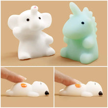 Two cartoon animal figures, one white and one green, on a beige background. Below are two images showing the figures being pressed.