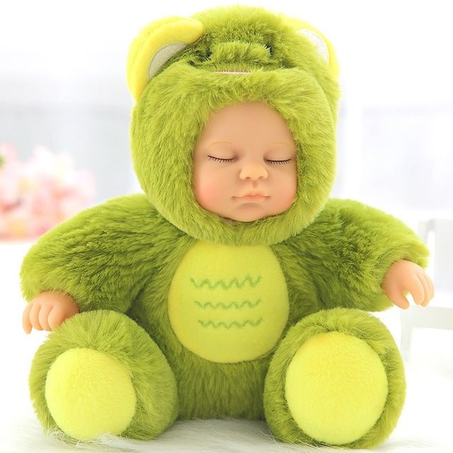 Baby doll in a green frog costume on a white background