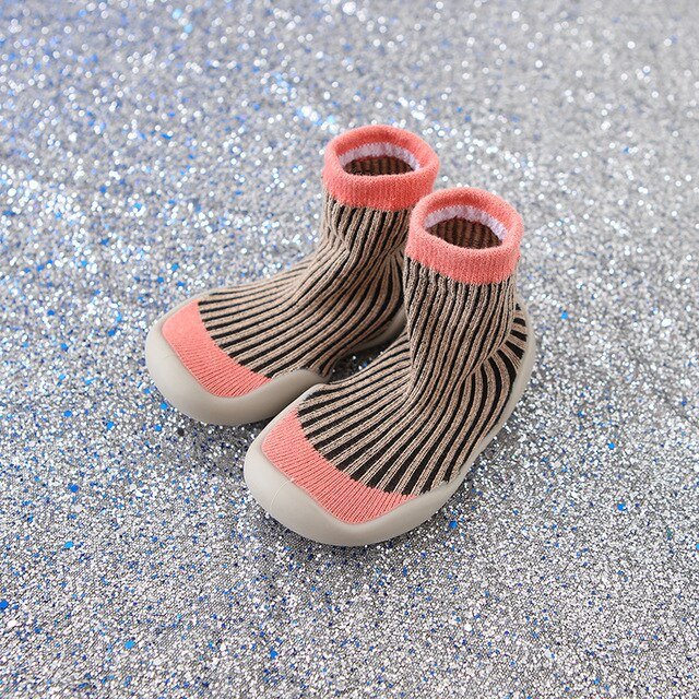 Pair of baby socks with pink accents 