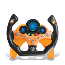 Orange and black toy steering wheel with a blue lit dial
