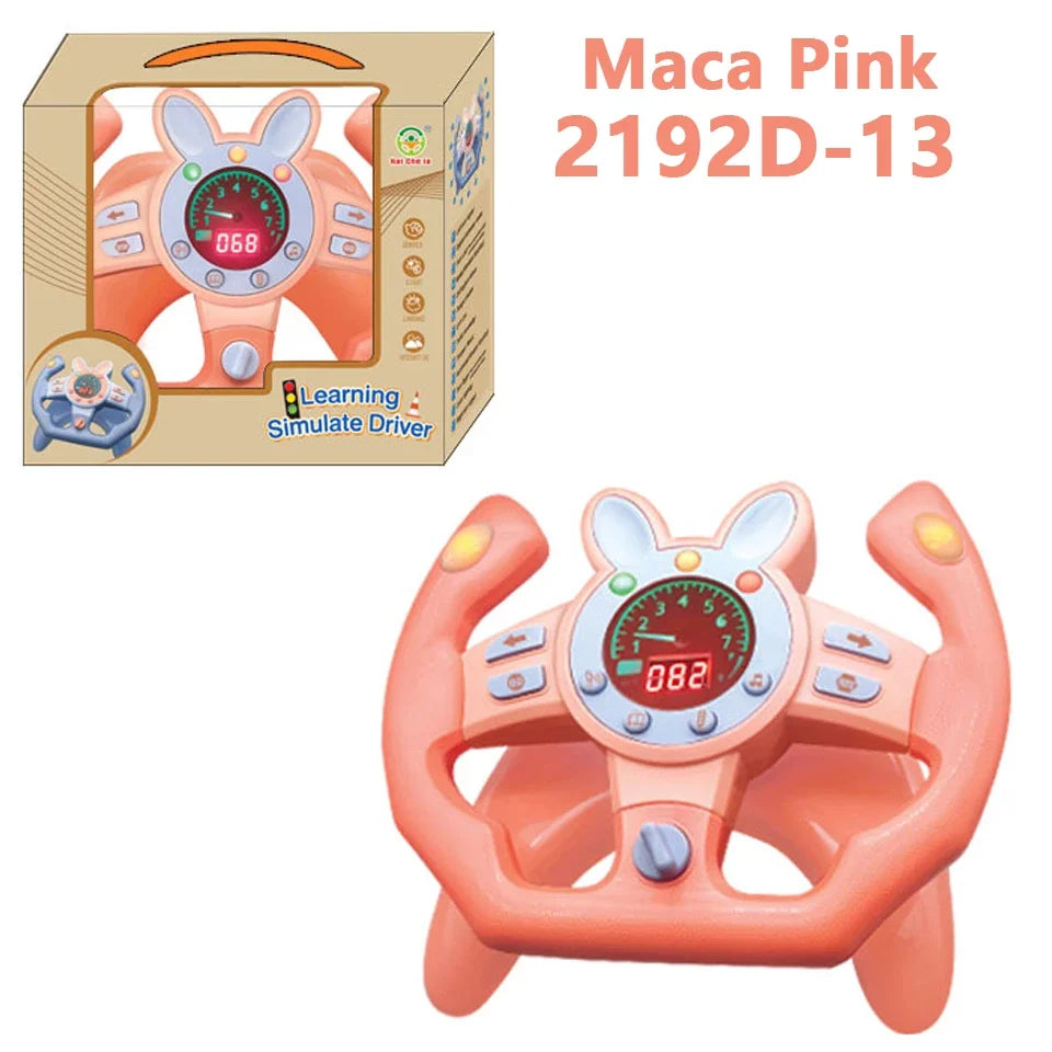 Pink bunny-style steering wheel toy beside its box, labeled Maca Pink 2192D-13