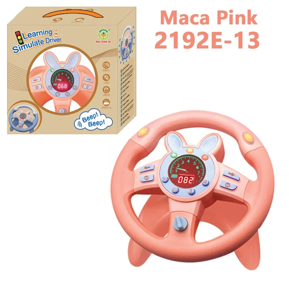 Pink bunny-style steering wheel toy beside its box, labeled Maca Pink 2192E-13