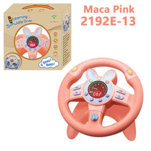Pink bunny-style steering wheel toy beside its box, labeled Maca Pink 2192E-13