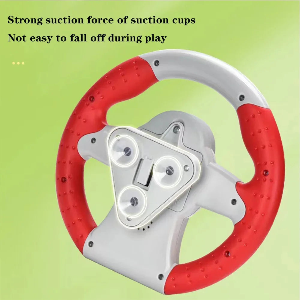 Back of a red and grey toy steering wheel showing three suction cups