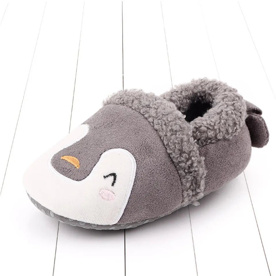 Overhead view of grey Knit Baby Slippers, simple knit booties that match most baby outfits for daily wear.