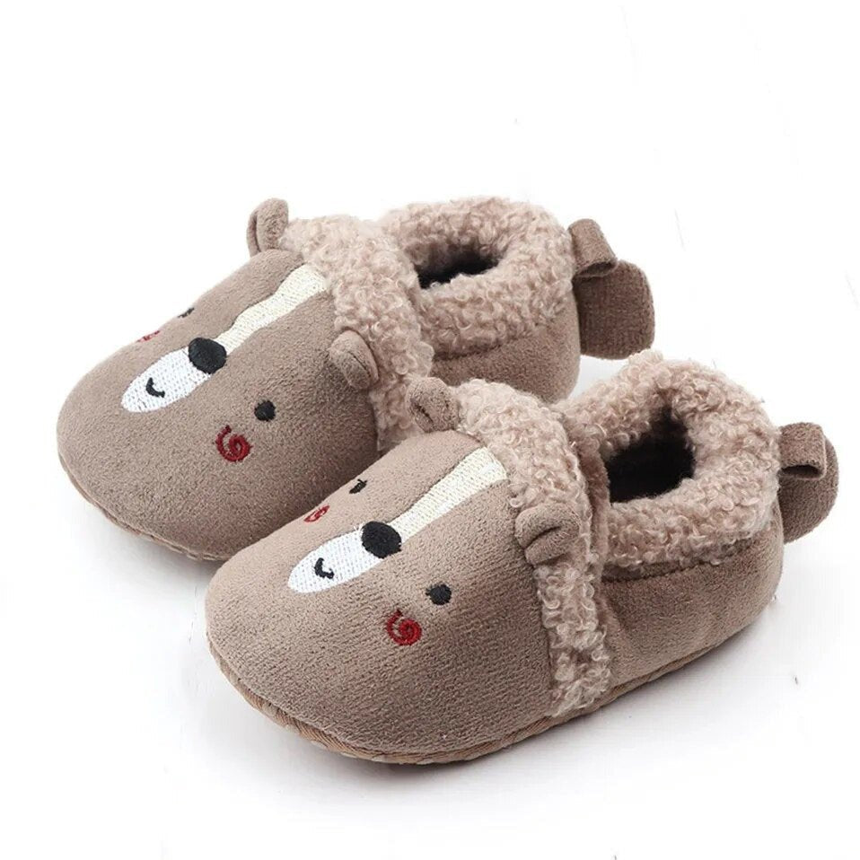 Adorable Knit Baby Slippers worn on baby feet, cosy crib shoes for indoor crawling and play mat time.