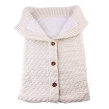 Knitted baby sleeping bag in an anti-kick design so babies stay covered through the night.