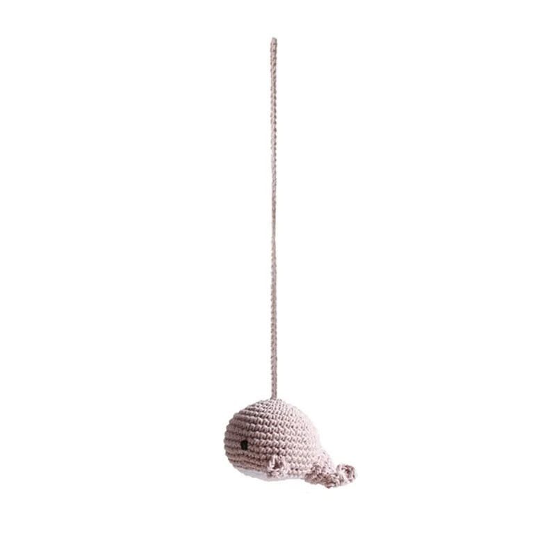 Knitted whale pendant close-up, a soft hanging toy for the wooden baby gym that supports early visual tracking.