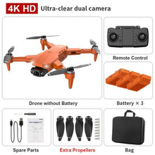L900 Pro SE Drone in orange with battery pack and carry bag for portable outdoor flying.