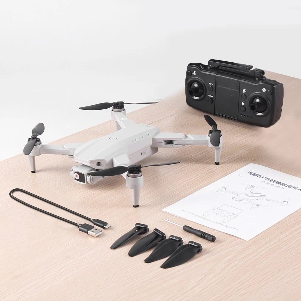 L900 Pro SE Drone in white shown on a wooden surface for size reference before flying.