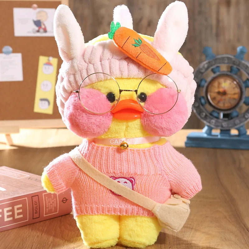Cafe duck plush toy with bunny ears on a wooden surface for playful costume styling and cuddles.