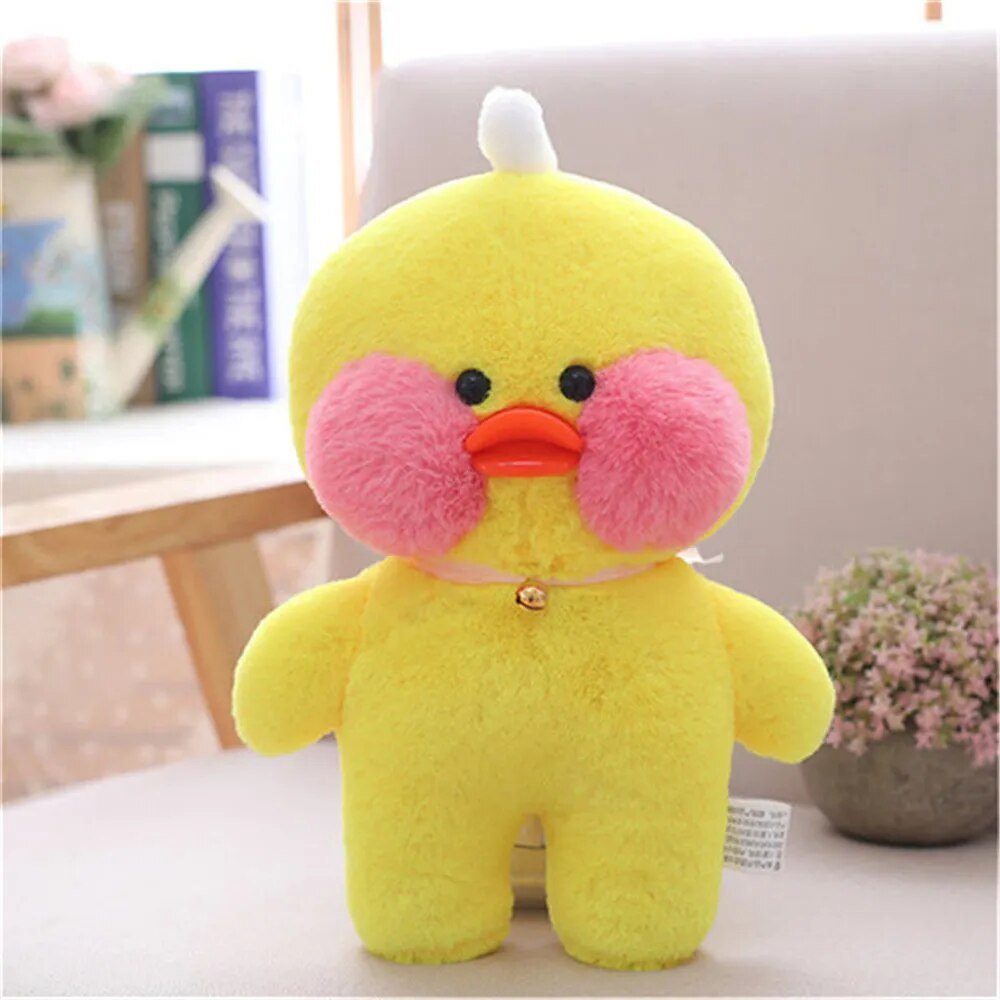 Yellow plush toy with pink cheeks 
