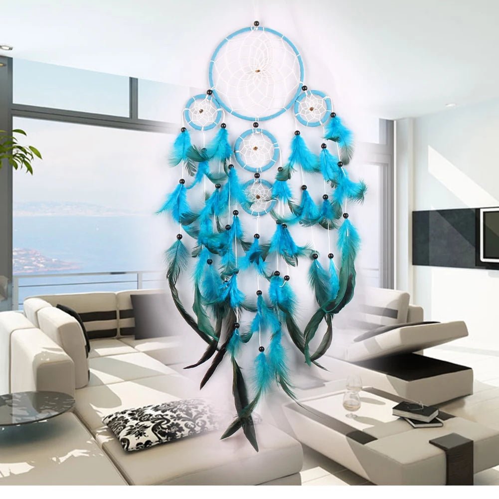 Large blue and green feather dream catcher styled in an ethnic boho living room.