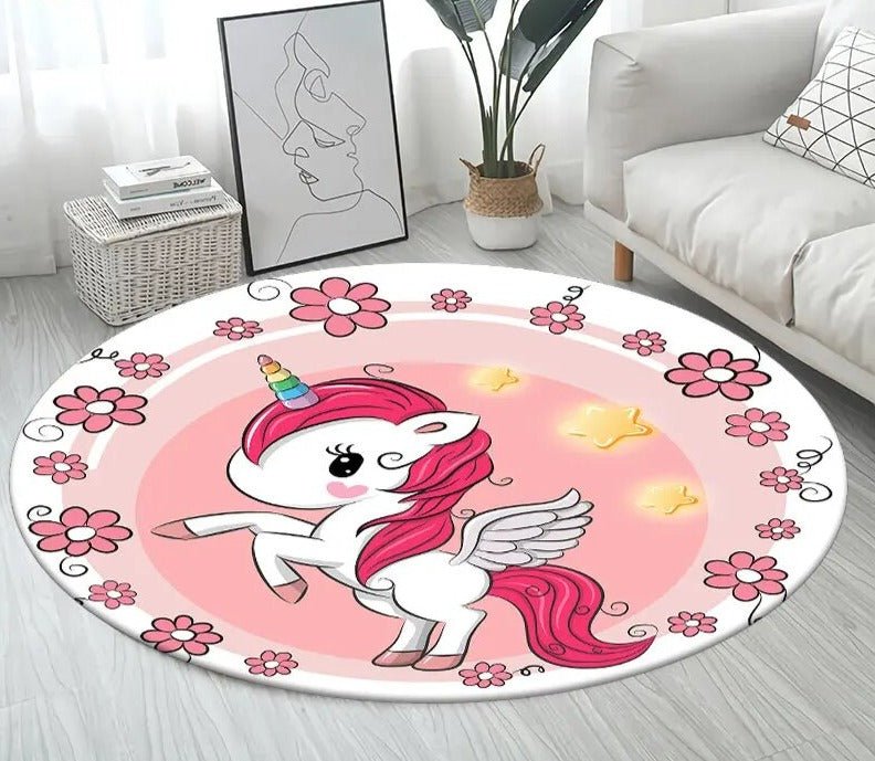 Large round unicorn 3D rug laid on a wooden floor as a non-slip mat for kids rooms and cosy reading spots.