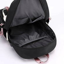 Large USB Canvas Backpack with open front compartment for organizing school supplies.