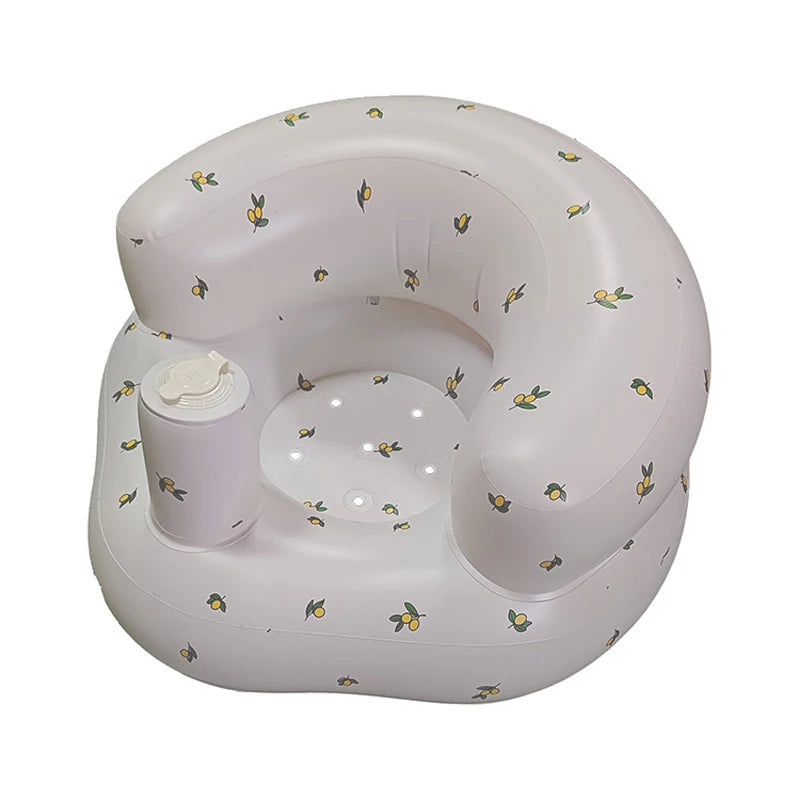 Lemon-print inflatable baby seat with cup holder for feeding time and play.
