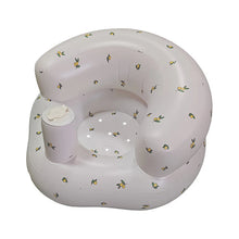 Lemon-print inflatable baby seat with cup holder for feeding time and play.