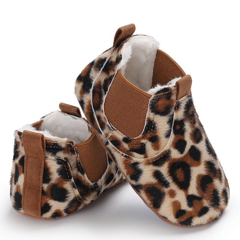 Pair of leopard print baby shoes with brown accents 