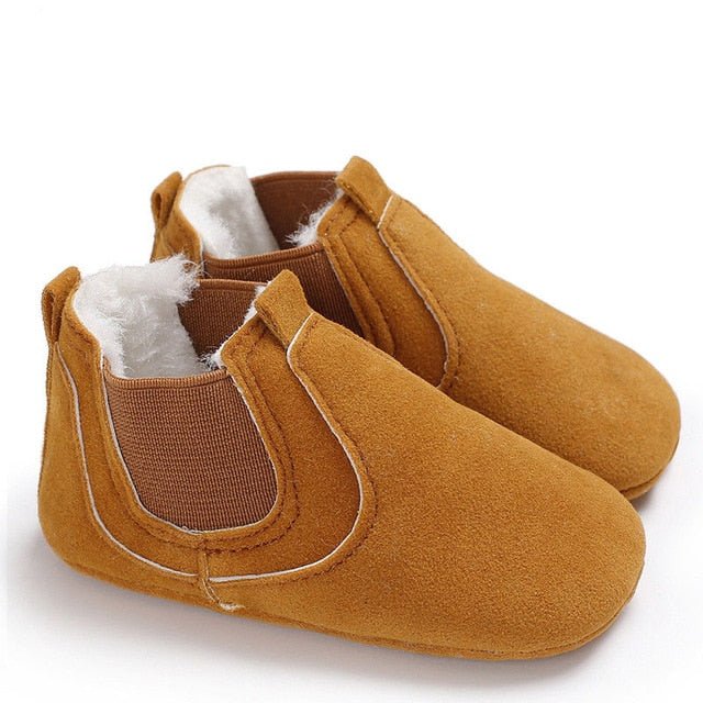 Pair of brown baby shoes with white fur lining
