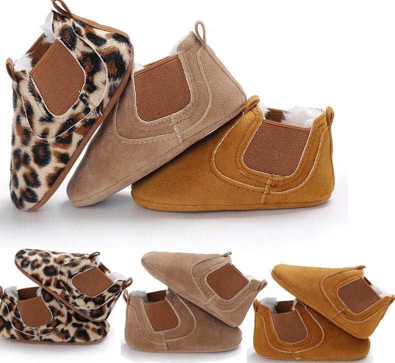 Pair of baby shoes with leopard print and brown suede.