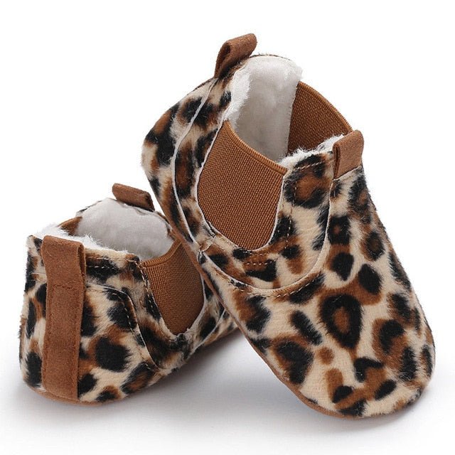 Pair of leopard print baby shoes with brown accents