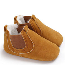 Pair of brown baby shoes with white fur lining