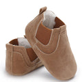 Pair of brown baby shoes with soft interior