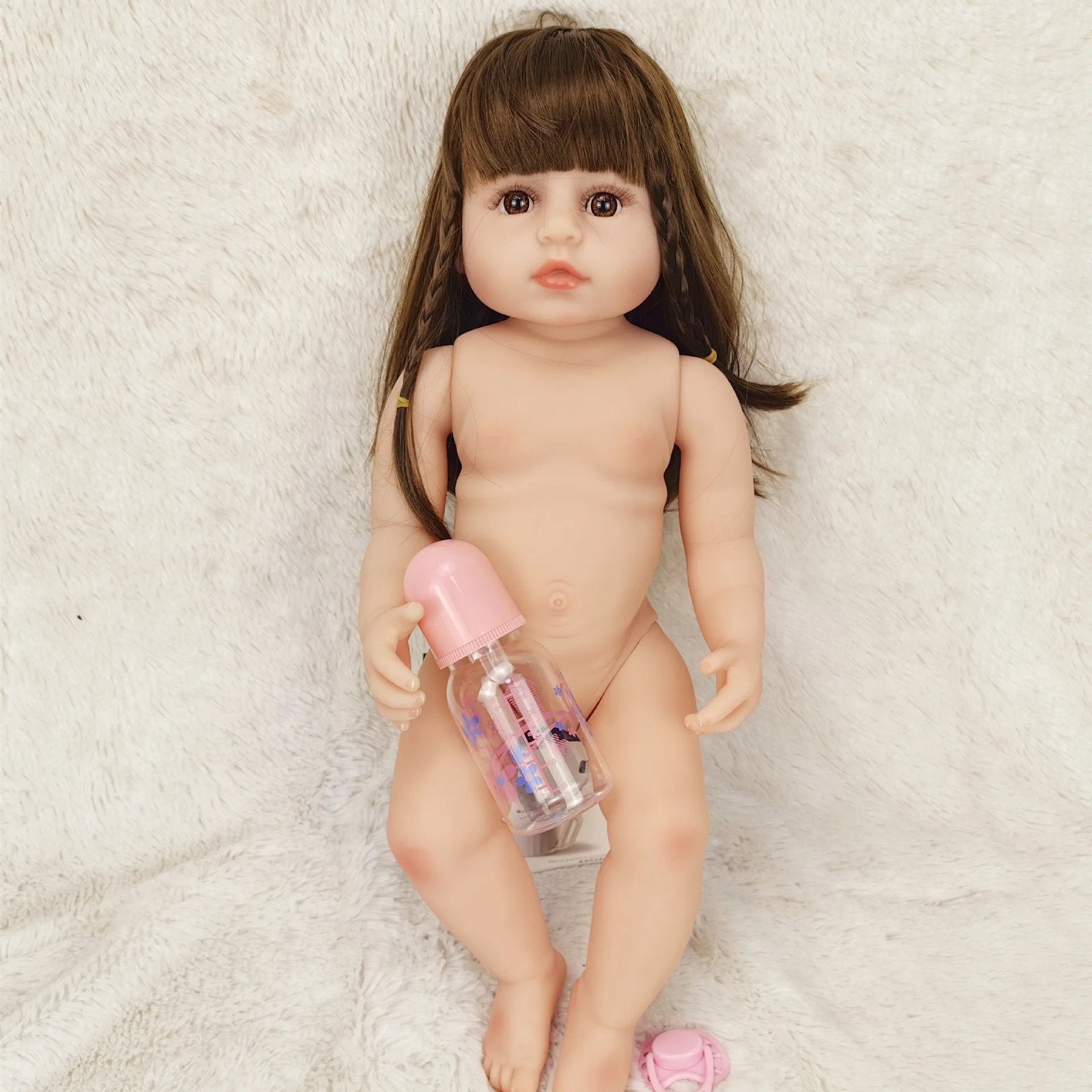 Lifelike Betty Princess full silicone Reborn Doll body view with a pink bottle for bathing routines and hands-on care play.
