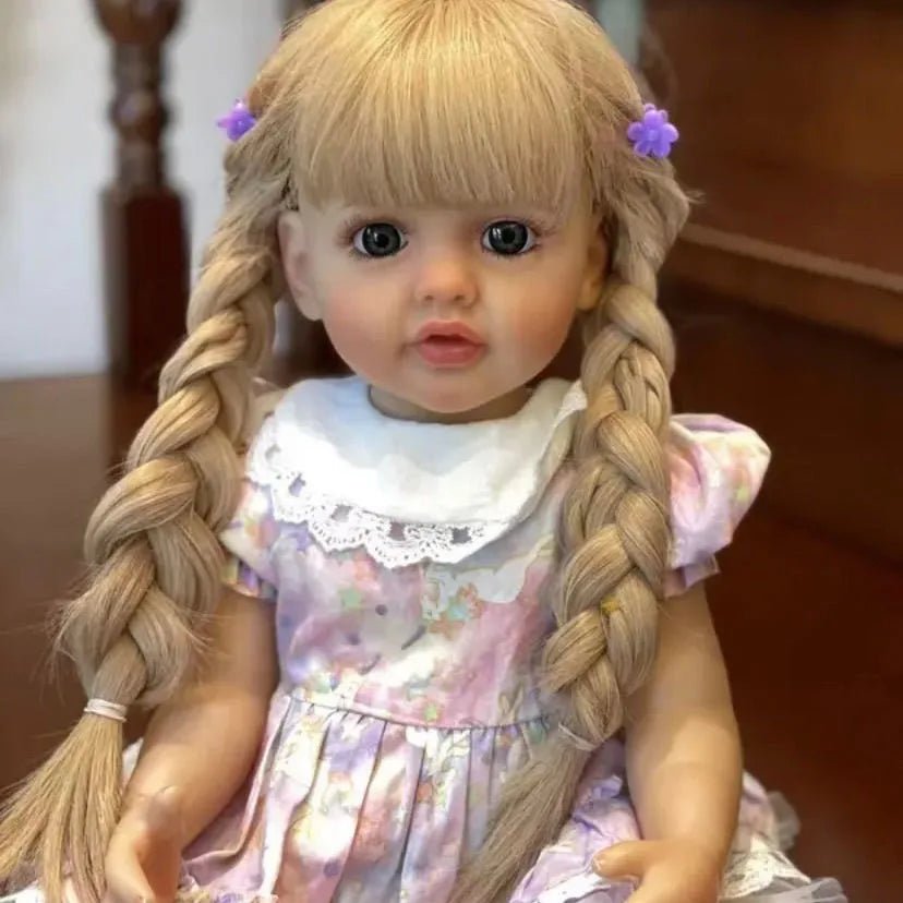 Lifelike full silicone Reborn Doll Betty Princess with braided long hair and floral dress for pretend play and doll photography.