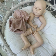 Lifelike Joleen reborn doll parts with pink outfit for hobby doll assembly and finishing projects.