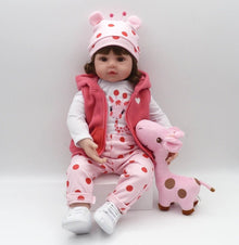 Lifelike reborn toddler doll with a sleeping face holding a pink giraffe toy for calm cuddles and nursery display.