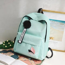 Light blue Kawaii Harajuku backpack styled in a bedroom setting for school carry and after-class outings.
