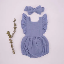 Light blue ruffle romper and headband in organic cotton, a breathable summer set for strolls and garden play.