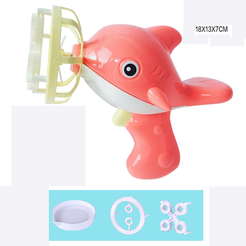 Pink shark-shaped bath toy with a brush attachment.