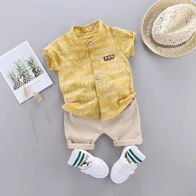 Children's outfit with yellow shirt, beige shorts, white shoes, and a straw hat