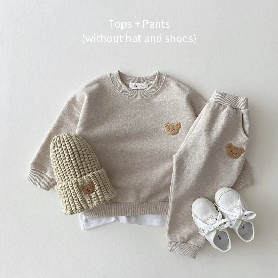 Children's outfit with beige sweater, pants, hat, and shoes. (option 5)