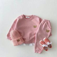 Pink children's outfit with bear