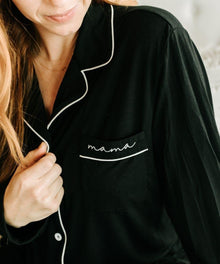 Black pajama top with 'mama' embroidery.