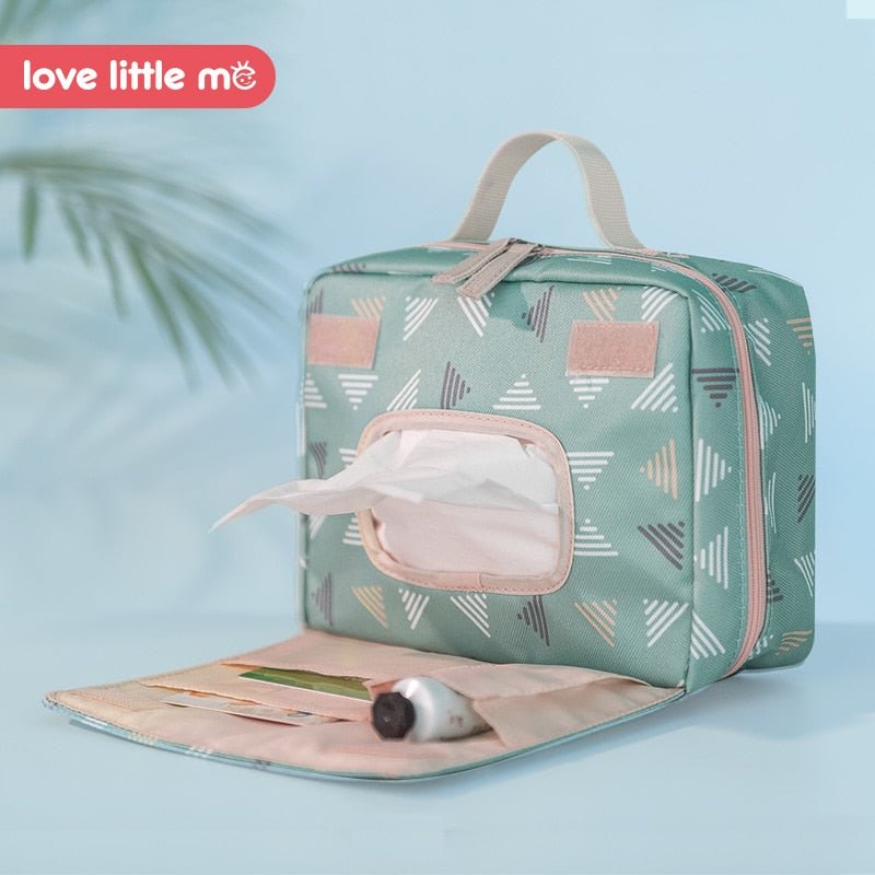 Love Little Me Portable Baby Diaper Bag toiletry pouch in green and pink for travel essentials.