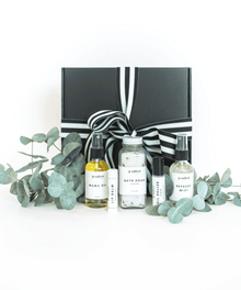 Luxury black self care gift box with a skincare set and eucalyptus for spa-style pampering and special occasion gifting.